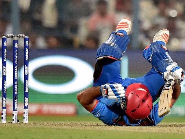 Afghanistan batsman Samiullah Shenwari takes a tumble after hitting a shot. (PTI) Afghanistan batsman Samiullah Shenwari takes a tumble after hitting a shot. (PTI)