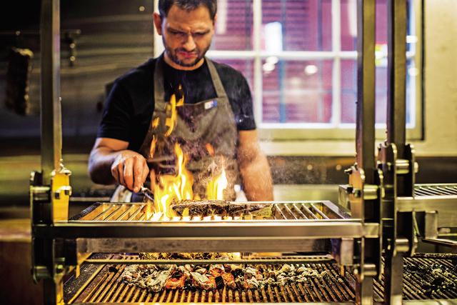 A slice of Sydney: At Firedoor (above), your food is cooked in front of you on an open fire