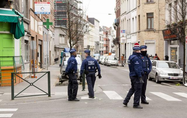 Policemen patrol Molenbeek's neighbourhood in Brussels on Saturday. (AFP) Policemen patrol Molenbeek's neighbourhood in Brussels on Saturday. (AFP)