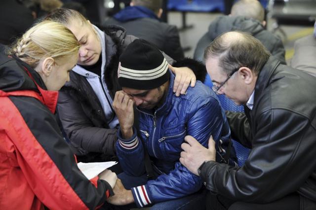 A psychologist of the Russian Emergencies Ministry (L) speaks with a relative (C) of a victim of the crashed Flydubai Boeing 737-800 at the airport of Rostov-On-Don, Russia. (REUTERS) A psychologist of the Russian Emergencies Ministry (L) speaks with a relative (C) of a victim of the crashed Flydubai Boeing 737-800 at the airport of Rostov-On-Don, Russia. (REUTERS)