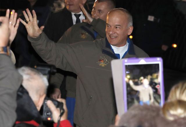 Nasa astronaut Jeff Williams waves as he walks to a bus from a hotel prior the launch of Soyuz-FG rocket. (AP Photo)