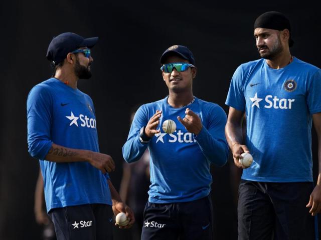 Indian cricketers, from left to right, Ravindra Jadeja, Pawan Negi and Harbhajan Singh, during a training session. (AP)