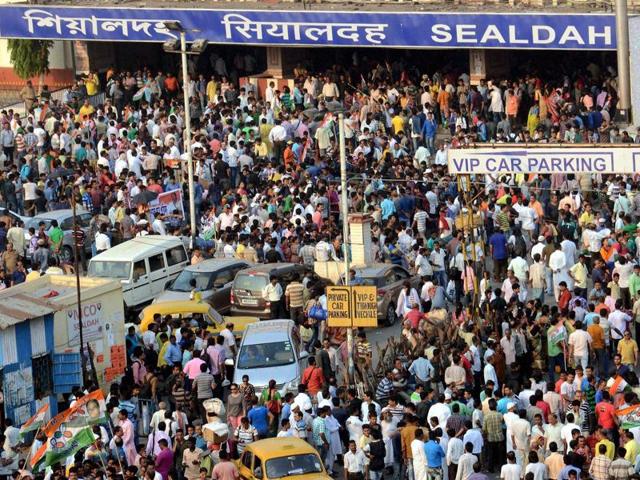 TMC workers during a protest rally against a TV channel whose sting operation showed their party leaders accepting bribe, at Sealdah railway station in Kolkata. (PTI Photo)
