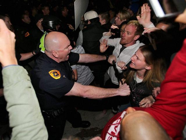 Salt Lake Police push protesters back at a rally outside the Infinity Events Center in Salt Lake City, where Republican Presidential candidate Donald Trump held a campaign rally. (AP Photo) Salt Lake Police push protesters back at a rally outside the Infinity Events Center in Salt Lake City, where Republican Presidential candidate Donald Trump held a campaign rally. (AP Photo)