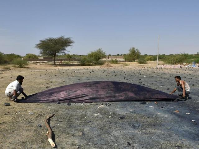 The dyed cloth is once again dried in the sun for a couple of hours. (Arijit Sen/ht photo) The dyed cloth is once again dried in the sun for a couple of hours. (Arijit Sen/ht photo)