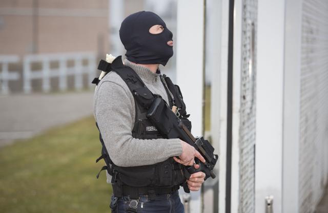 A special forces police officer awaits a convoy and ambulance believed to be carrying captured fugitive Salah Abdeslam at the federal penitentary in Bruges, Belgium. (AP Photo) A special forces police officer awaits a convoy and ambulance believed to be carrying captured fugitive Salah Abdeslam at the federal penitentary in Bruges, Belgium. (AP Photo)