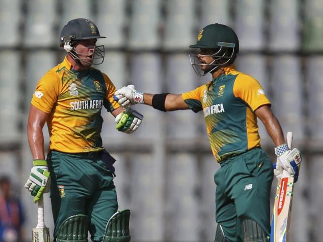 South Africa's AB de Villiers (L) is congratulated by his teammate Jean-Paul Duminy after scoring his half century during the World T20 match against Afghanistan at Mumbai’s Wankhede stadium on March 20, 2016. De Villiers’ 64 off 29 balls set the tone for South Africa’s 37-run win. (REUTERS) South Africa's AB de Villiers (L) is congratulated by his teammate Jean-Paul Duminy after scoring his half century during the World T20 match against Afghanistan at Mumbai’s Wankhede stadium on March 20, 2016. De Villiers’ 64 off 29 balls set the tone for South Africa’s 37-run win. (REUTERS)