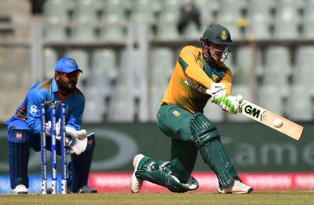 South Africa's Quinton de Kock (R) is watched by Afghanistan wicketkeeper Mohammad Shahzad as he plays a shot. (AFP) South Africa's Quinton de Kock (R) is watched by Afghanistan wicketkeeper Mohammad Shahzad as he plays a shot. (AFP)