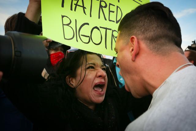 A protester confronts a supporter of Republican presidential candidate Donald Trump in downtown Salt Lake City as Donald Trump gave his first campaign speech in Utah. (AP Photo) A protester confronts a supporter of Republican presidential candidate Donald Trump in downtown Salt Lake City as Donald Trump gave his first campaign speech in Utah. (AP Photo)
