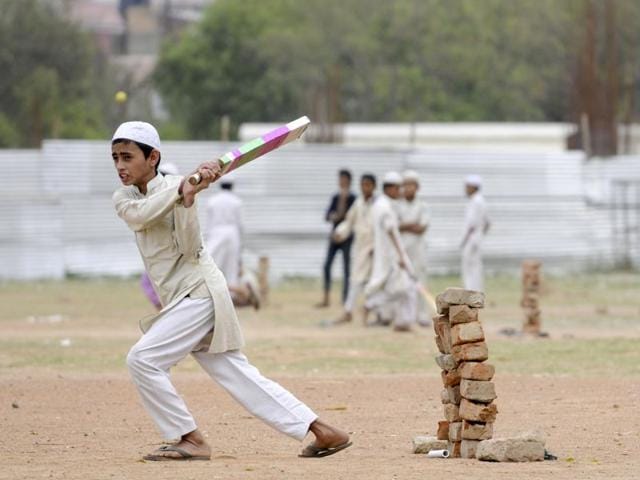 As the T20 World Cup is being aired across TV sets across the country, young boys enjoy a game of cricket as their Madrasa does not have a TV set. (Sunil Ghosh/HT Photo)