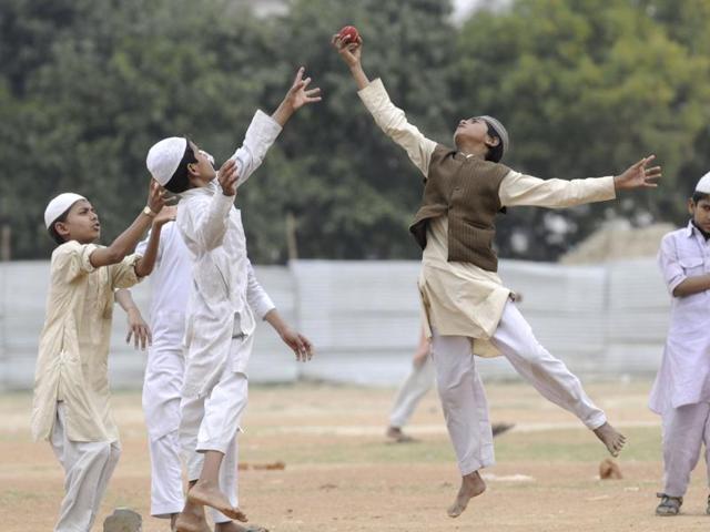 As the T20 World Cup is being aired across TV sets across the country, young boys enjoy a game of cricket as their Madrasa does not have a TV set. (Sunil Ghosh/HT Photo)
