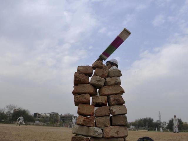 As the T20 World Cup is being aired across TV sets across the country, young boys enjoy a game of cricket as their Madrasa does not have a TV set. (Sunil Ghosh/HT Photo)