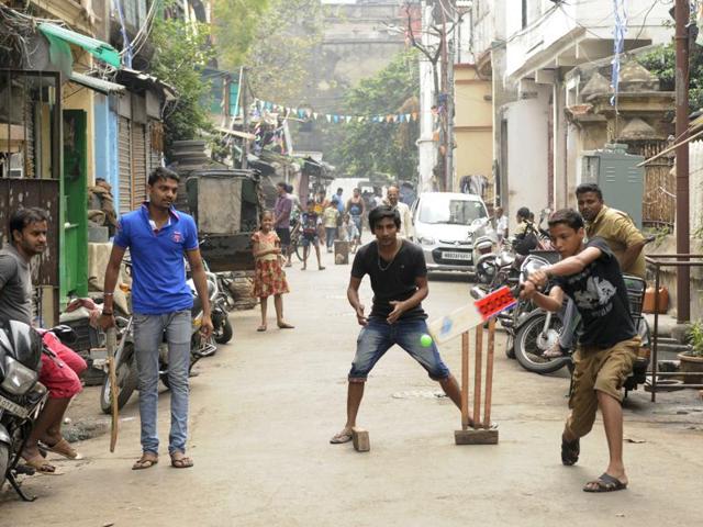 Due to Scarcity of ground, gully (street) cricket is very popular among youth. Here, youngsters are enjoying gully cricket as ICC World T 20 Cup 2016 catches on. (Samir Jana/HT Photo)