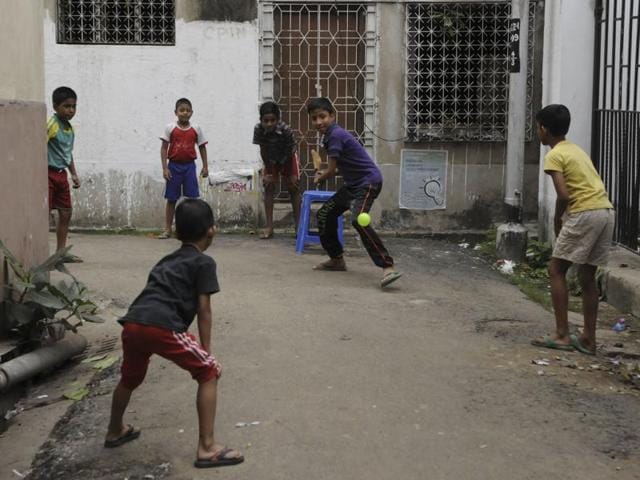Children sweat it out during a gully cricket tournament as T20 fever catches India. (Subhendu Ghosh/HT Photo )