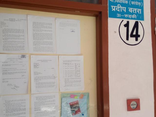 The wall of Congress MLA Pradeep Batra’s house in Dehradun. The Uttarakhand Speaker issued notices to Batra and eight other rebel MLAs of the party for aligning with BJP.(Anupam Trivedi / HT Photo) The wall of Congress MLA Pradeep Batra’s house in Dehradun. The Uttarakhand Speaker issued notices to Batra and eight other rebel MLAs of the party for aligning with BJP.(Anupam Trivedi / HT Photo)