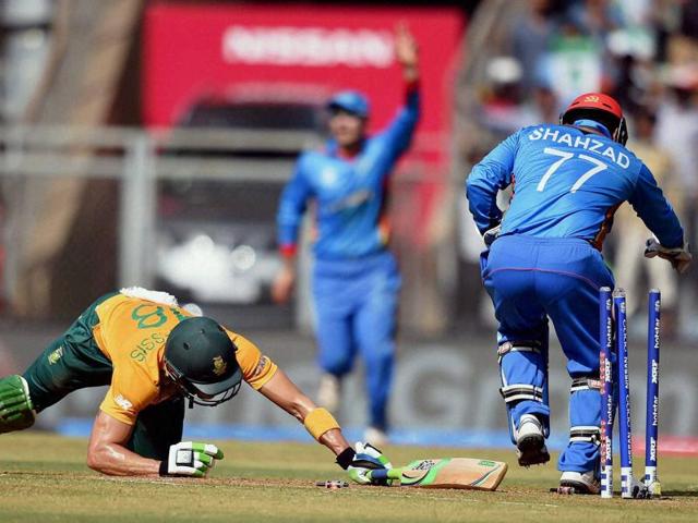 South Africa’s Faf du Plessis falls short of his crease as Afghanistan wicket-keeper Mohammad Shahzad runs him out. (PTI ) South Africa’s Faf du Plessis falls short of his crease as Afghanistan wicket-keeper Mohammad Shahzad runs him out. (PTI )