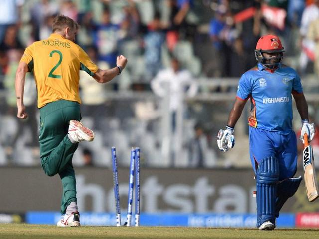 Chris Morris celebrates after bowling out Afghanistan opener Mohammad Shahzad for 44 off 19 balls. (PTI) Chris Morris celebrates after bowling out Afghanistan opener Mohammad Shahzad for 44 off 19 balls. (PTI)