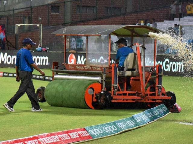 Groundsman use a Water Supper to remove the rain water as rains interrupt the Women’s India Pakistan World Cup T20 match in New Delhi. (PTI Photo)