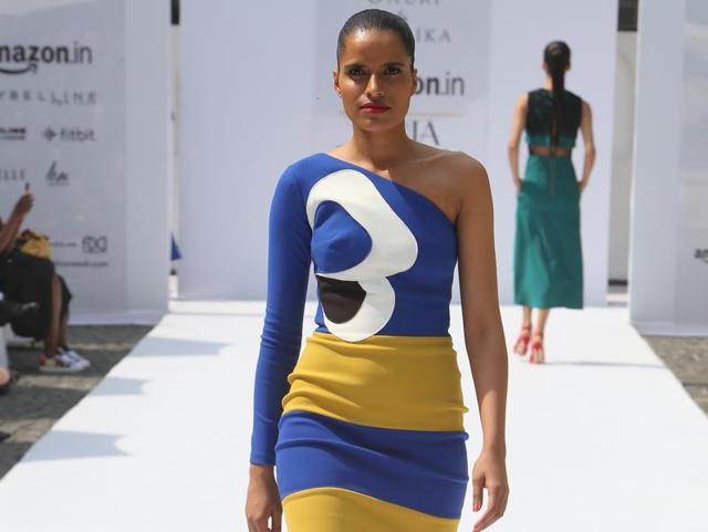 Designers Gauri and Nainika play with solid colours in a one-shouldered fitting dress.  (Raajessh Kashyap/HT) 
