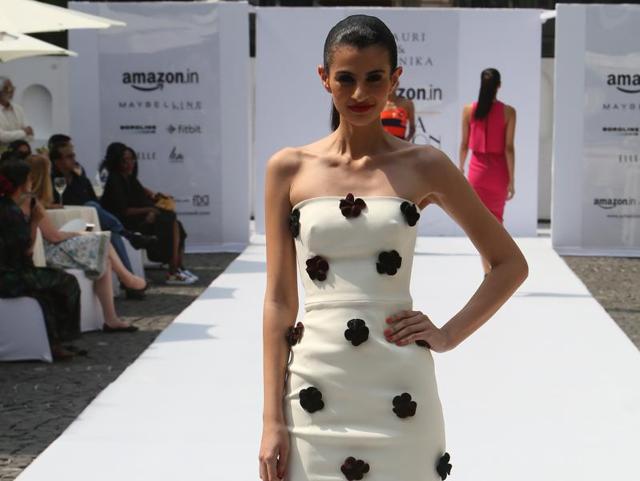 The black floral applique on the white strapless dress by Gauri and Nainika can make heads turn  at any party. (Raajessh Kashyap/HT) 