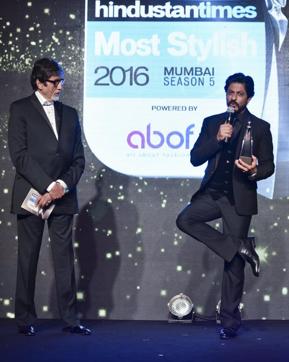 SRK and Amitabh Bachchan share a moment during the event. (HT photo)