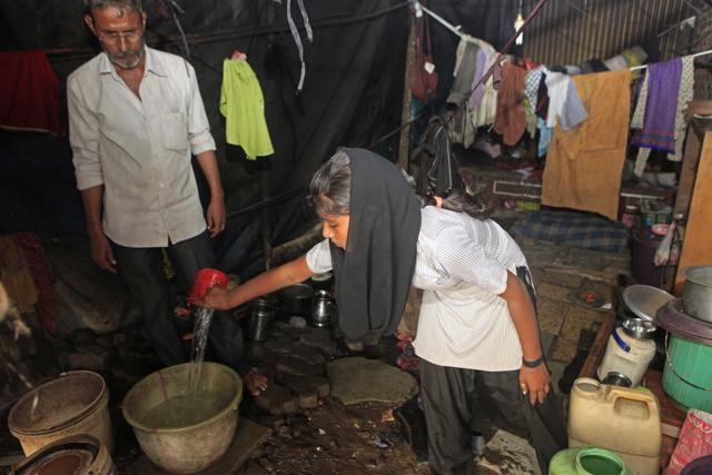 “This year, things have been so desperate that we carved holes into the tarpaulin sheet over our shanty and placed buckets below to collect rainwater,” says Jamil Akhtar Shaikh, a 46-year-old father of four and resident of Ambujwadi, Malad. (Pratham Gokhale/HT Photo )