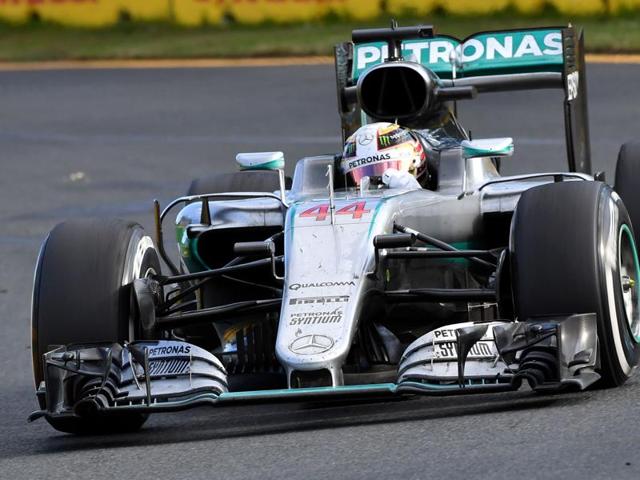 Mercedes AMG Petronas F1 Team's German driver Nico Rosberg (C) celebrates on the podium next to Mercedes AMG Petronas F1 Team's British driver Lewis Hamilton (L) and Ferrari's German driver Sebastian Vettel (R) during the Formula One Australian Grand Prix in Melbourne on March 20, 2016. (AFP) Mercedes AMG Petronas F1 Team's German driver Nico Rosberg (C) celebrates on the podium next to Mercedes AMG Petronas F1 Team's British driver Lewis Hamilton (L) and Ferrari's German driver Sebastian Vettel (R) during the Formula One Australian Grand Prix in Melbourne on March 20, 2016. (AFP)