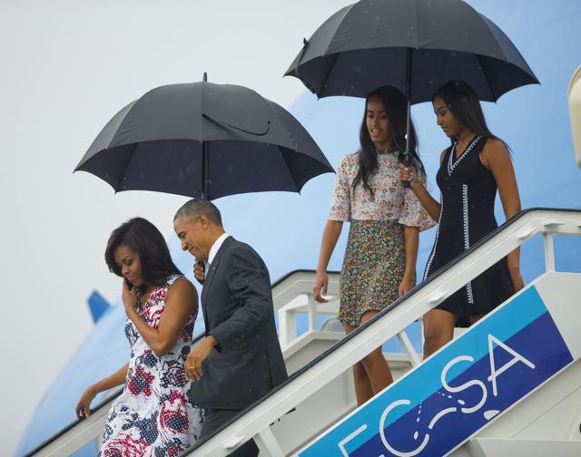 President Barack Obama, second from left, arrives with first lady Michelle Obama, left, and their daughters Sasha, right, and Malia, as they exit Air Force One at the airport in Havana, Cuba. (AP Photo) President Barack Obama, second from left, arrives with first lady Michelle Obama, left, and their daughters Sasha, right, and Malia, as they exit Air Force One at the airport in Havana, Cuba. (AP Photo)
