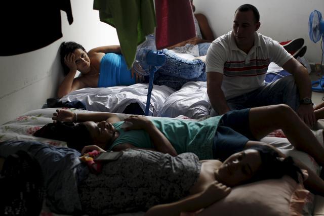 Cuban migrants rest inside a room at an old hotel used as a provisional shelter in Paso Canoas, at the border with Costa Rica. (REUTERS) Cuban migrants rest inside a room at an old hotel used as a provisional shelter in Paso Canoas, at the border with Costa Rica. (REUTERS)