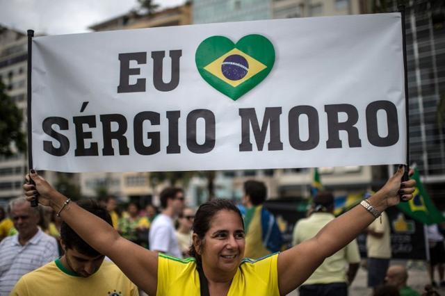 A woman praised the chief investigating judge in the Petrobras scandal, Sergio Moro, as "Our national pride" during a protest at Copacabana beach in Rio de Janeiro on March 13, 2016. (AFP)