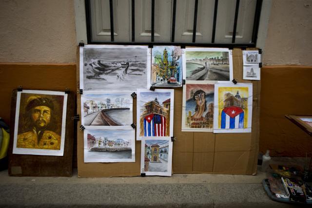 An artwork featuring side-by-side Cuban and American national flags is displayed at the street stand of artist Yaset Martin Hernandez in Old Havana, Cuba. (AP Photo) An artwork featuring side-by-side Cuban and American national flags is displayed at the street stand of artist Yaset Martin Hernandez in Old Havana, Cuba. (AP Photo)