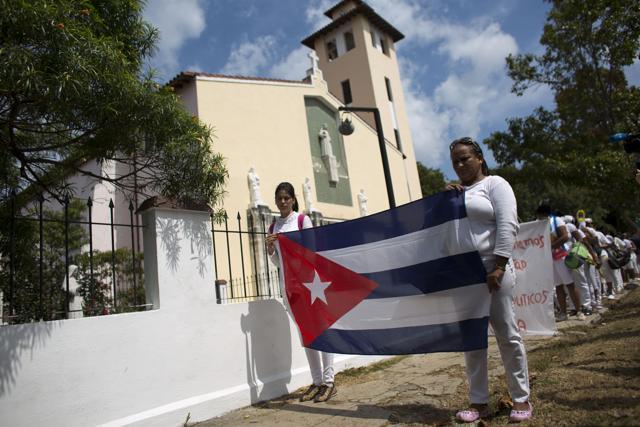 Ladies in White, a women's dissident group that calls for the release of political prisoners, begin their weekly march in Havana, Cuba. (AP Photo) Ladies in White, a women's dissident group that calls for the release of political prisoners, begin their weekly march in Havana, Cuba. (AP Photo)