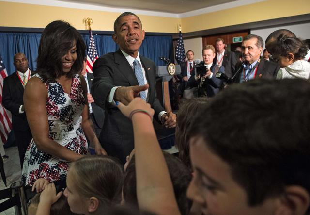 US President Barack Obama and First Lady Michelle Obama greet children of US embassy staff in Havana. (AFP Photo) US President Barack Obama and First Lady Michelle Obama greet children of US embassy staff in Havana. (AFP Photo)