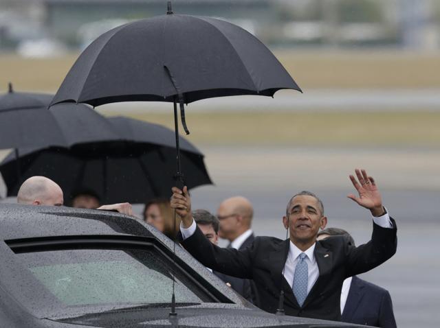 US President Barack Obama waves soon after he arrived at Havana's international airport. (Reuters Photo) US President Barack Obama waves soon after he arrived at Havana's international airport. (Reuters Photo)
