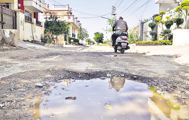 A damaged road at Basant City in Ludhiana on Sunday. (Sikander Singh Chopra/HT photo) A damaged road at Basant City in Ludhiana on Sunday. (Sikander Singh Chopra/HT photo)