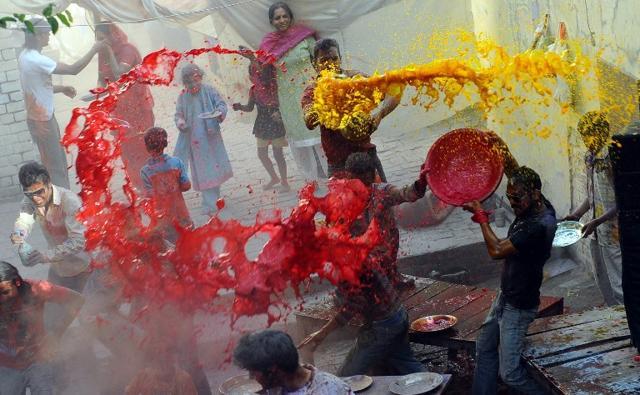 Pakistani Hindus throw coloured water on each other during Holi in Lahore in this file photo. (AFP File Photo) Pakistani Hindus throw coloured water on each other during Holi in Lahore in this file photo. (AFP File Photo)