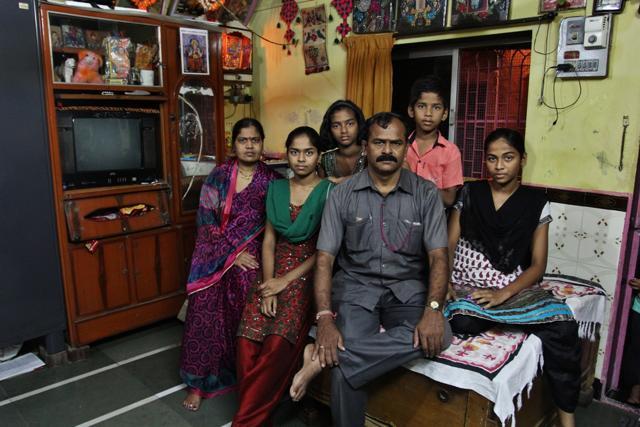 The six-member Kharade family stays up until the wee hours, to fill water -- as do most of their neighbours in Vikroli’s Varsha Nagar. Mahadev Kharade, a security guard, is forced to wear the same unwashed uniform for three to five days at a time. “I would like for my husband’s uniform to be odour-free, but how?” says his wife Fulabai . “We barely have enough to drink and wash utensils.” (Praful Gangurde /HT Photo)
