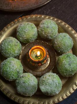 Go green with your platter by opting for pan laddu platter with a diya placed in the centre. Go green with your platter by opting for pan laddu platter with a diya placed in the centre.