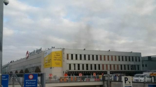 Black smoke is seen rising from the Brussels airport following the two explosions. (REUTERS) Black smoke is seen rising from the Brussels airport following the two explosions. (REUTERS)