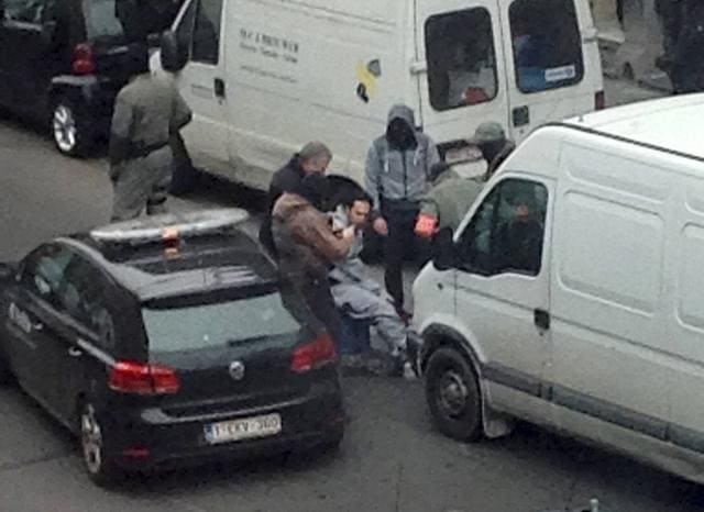 In this photo made available , an unidentified man believed to be connected to a key suspect in the November 2015 Paris attacks, Salah Abdeslam, is detained by police. (AP) In this photo made available , an unidentified man believed to be connected to a key suspect in the November 2015 Paris attacks, Salah Abdeslam, is detained by police. (AP)