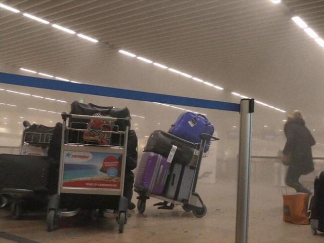 In this photo provided by Ralph Usbeck an unidentified traveller runs in a smoke filled terminal at Brussels Airport, in Brussels after explosions. (AP) In this photo provided by Ralph Usbeck an unidentified traveller runs in a smoke filled terminal at Brussels Airport, in Brussels after explosions. (AP)