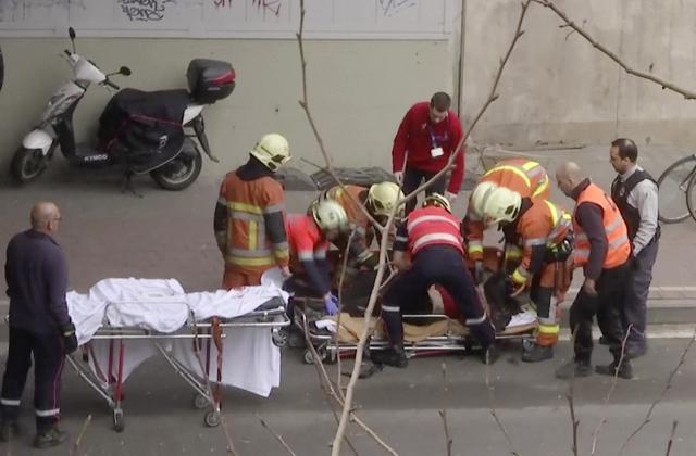 Emergency rescue workers assist an unidentified person at the site of an explosion at a metro station in Brussels, Belgium on Tuesday. (AP Photo) Emergency rescue workers assist an unidentified person at the site of an explosion at a metro station in Brussels, Belgium on Tuesday. (AP Photo)