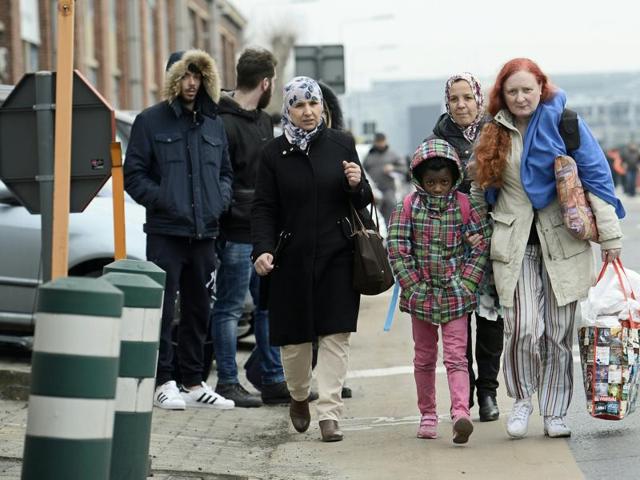 People are evacuated from Brussels airport after at least 13 people were killed in explosions.(AFP) People are evacuated from Brussels airport after at least 13 people were killed in explosions.(AFP)