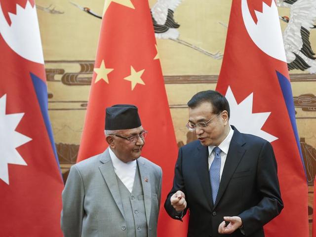 Chinese Premier Li Keqiang (R) with Nepal Prime Minister K.P. Sharma Oli during a signing ceremony at the Great Hall of the People in Beijing on March 21, 2016(AFP)