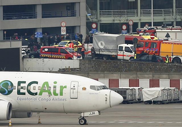 Emergency services at the scene of explosions at Zaventem airport near Brussels on Tuesday. (REUTERS) Emergency services at the scene of explosions at Zaventem airport near Brussels on Tuesday. (REUTERS)