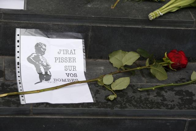 Floral tributes for the victims of Brussels attacks, including a picture of the Manneken Pis sculpture in Brussels, are placed on the steps of the Belgian embassy in Berlin, Germany. (Reuters) Floral tributes for the victims of Brussels attacks, including a picture of the Manneken Pis sculpture in Brussels, are placed on the steps of the Belgian embassy in Berlin, Germany. (Reuters)