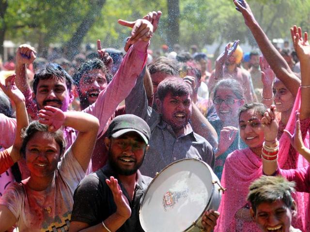 The next morning is celebrated as Holi - a riot carnival of colours, where participants have fun with dry powder and coloured water, with some carrying water guns (pichkaris) and water-filled balloons. (Bharat Bhushan/HT Photo)