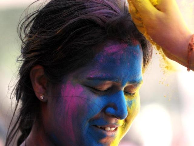Students celebrating Holi at Punjabi University in Patiala on Tuesday. (Bharat Bhushan/HT Photo)