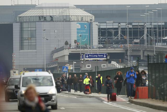 People leave the scene of the two explosions at Zaventem airport, near Brussels. (REUTERS) People leave the scene of the two explosions at Zaventem airport, near Brussels. (REUTERS)