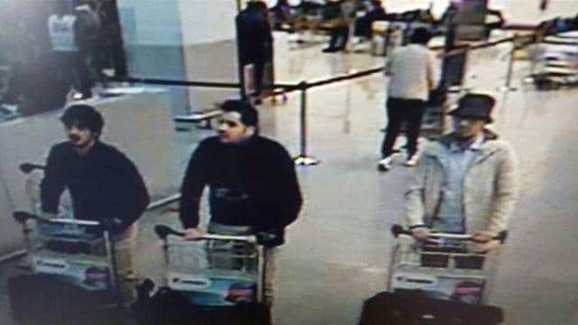 In this image provided by the Belgian Federal Police in Brussels, three men who are suspected of taking part in the attacks at Belgium's Zaventem Airport. Belgian police have launched a manhunt in search of the man in the white jacket (R). (AP Photo)